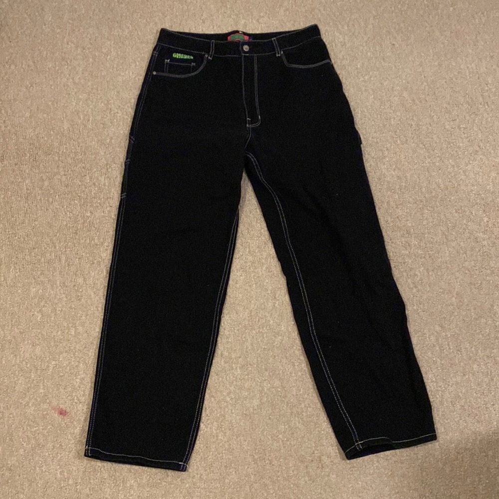 Black carpenter pants with white stitching